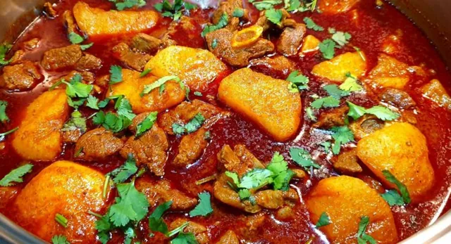 Golden potatoes in mutton curry